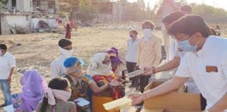 All India Welfare Society distributes masks and sanitizers