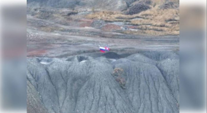 Flags of Russia and North Korea waved on Ukrainian soil