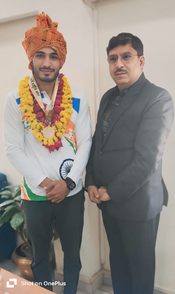 Shubham Gora, working in the Industry and Commerce Department, won the gold medal in (Wushu) in the 38th National Games. Shubham Gora, working in the Industry and Commerce Department, won the gold medal in (Wushu) in the 38th National Games.